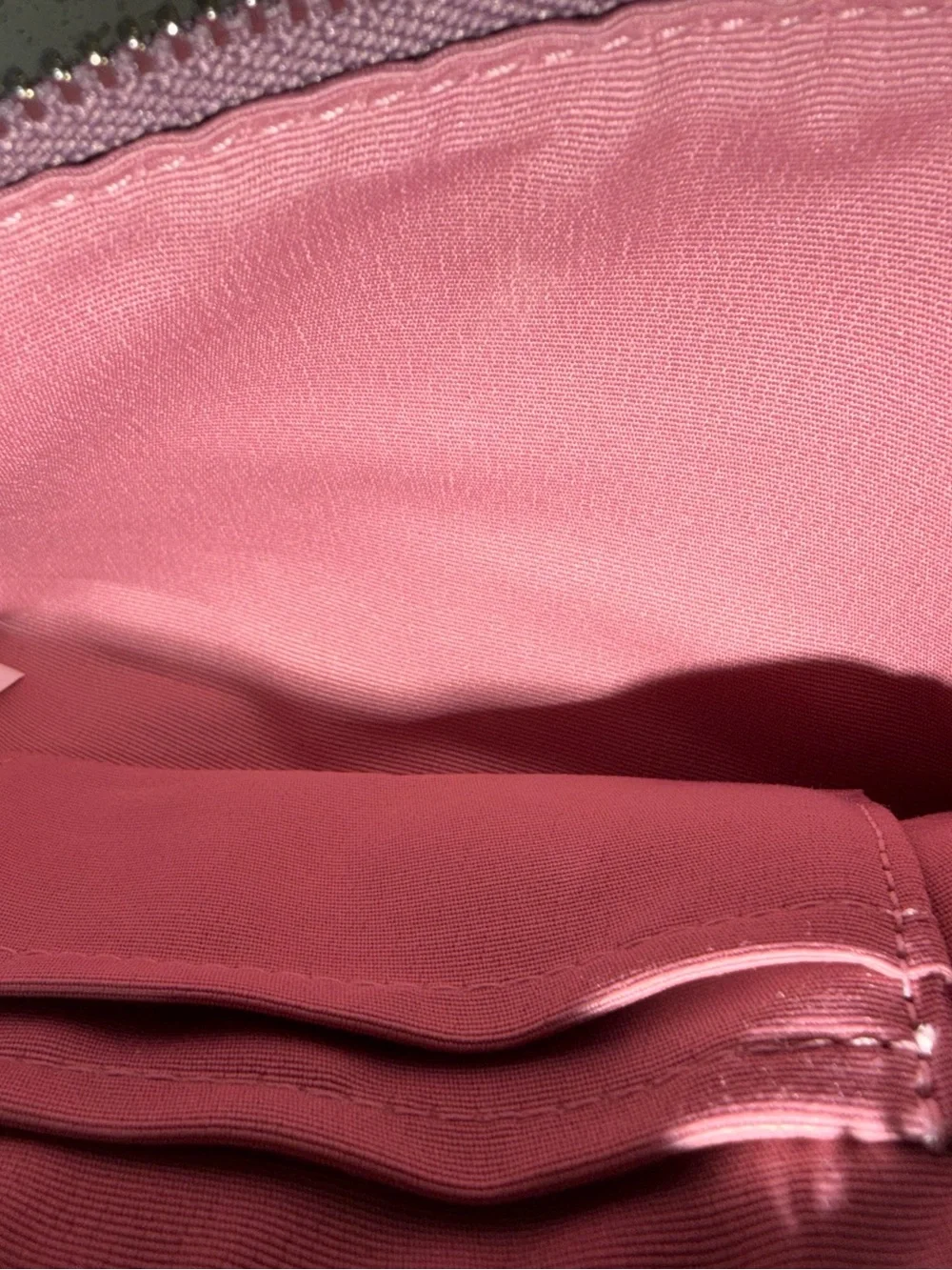Metallic pink coach wristlet